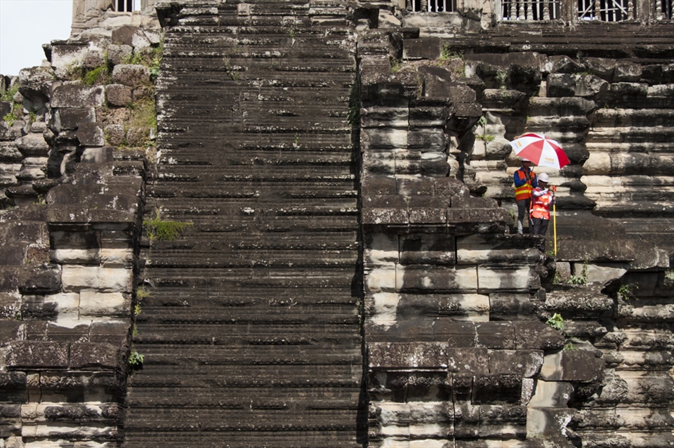 Engineers survey Ankor Wat in conservation efforts to preserve the structure. 