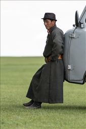 Then and now: a man in traditional dress (save for the natty trilby hat) takes 5 at the Naadam Festival near the ancient Mongolian capital of Karakorum. He leans against one of the thousands of Soviet-era minivans that ferry people and goods around Mongolia. Many are held together with wire, duct tape and sheer force of will: by davidburstein, Views[378]