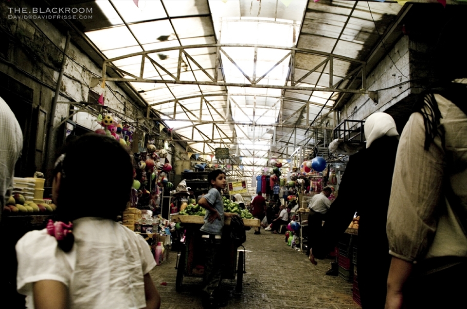 A boy and his sister selling vegetable inside Nablus old market