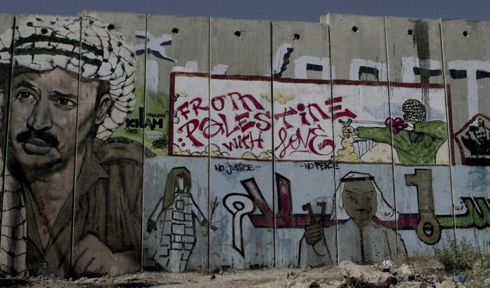 messages on the palestian side of the separation wall at Qalandia checkpoint
 