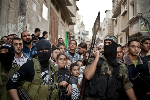 Hamas Al-Qassam fighters guard the roads of Gaza city