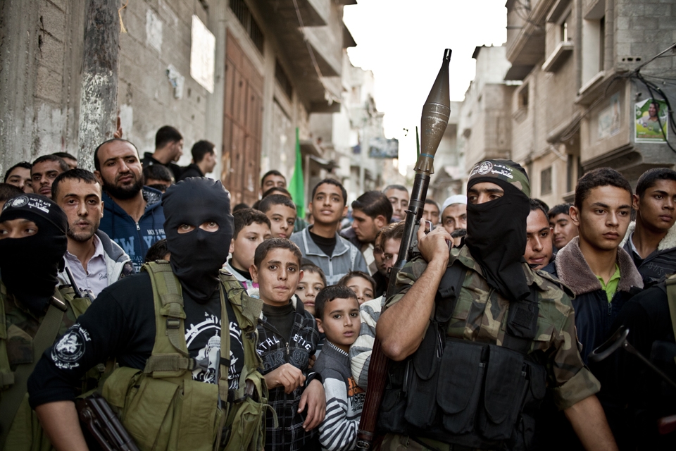 Hamas Al-Qassam fighters guard the roads of Gaza city