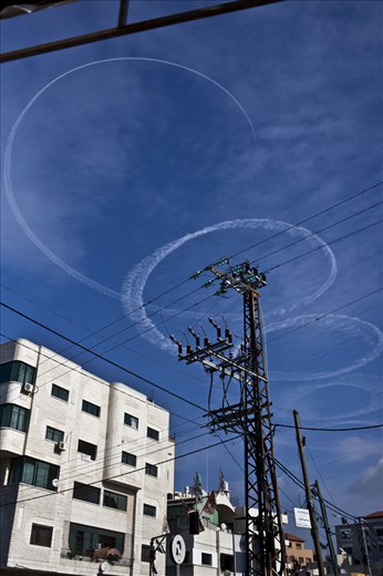 An Israeli fighter jet circles over Gaza city.