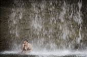 My travel partner enjoying the downpour of a large waterfall.: by dawn_canning, Views[359]