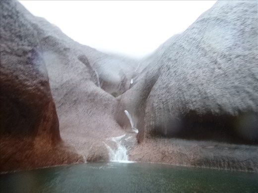 water hole with waterfall
