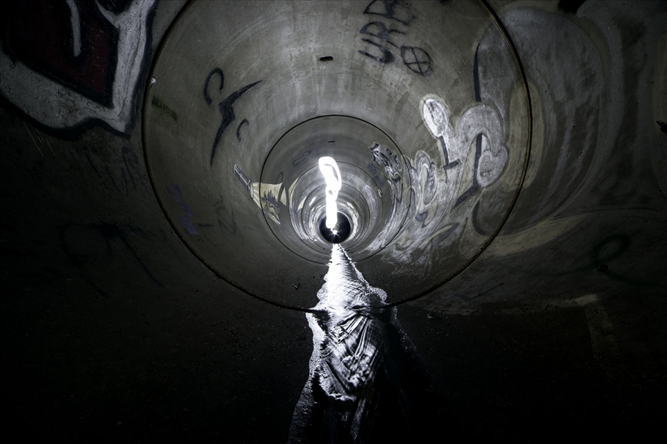 an amazing 7-8 foot round stormwater tunnel that lies underneath the earth