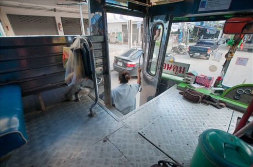 Taken the local bus is a perfect way to get off the beaten track. The tourist areas are a ongoing hustle and you end up going where everyone else goes. Traveling on a local bus has its challenges, In this case the ticket lady was more than happy to tell me when to get off. On route to Wat Bang Phra, Nakhon Pathom
Thailand. Cost of fare, 18 Baht   