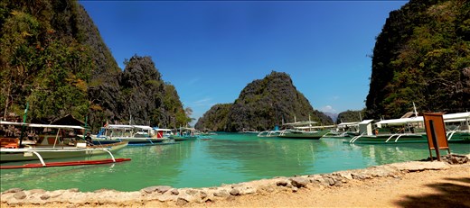 “Bangka” parking: After a 20min boat ride from Busuanga island we have reached our first destination for our island hopping tour. This is where they parked our boats and we began the 15min trek to this amazing paradise called Kayangan Lake.
* This is my panoramic shot of the boat parking. I patched more than 5 photos together to achieve this photo.
