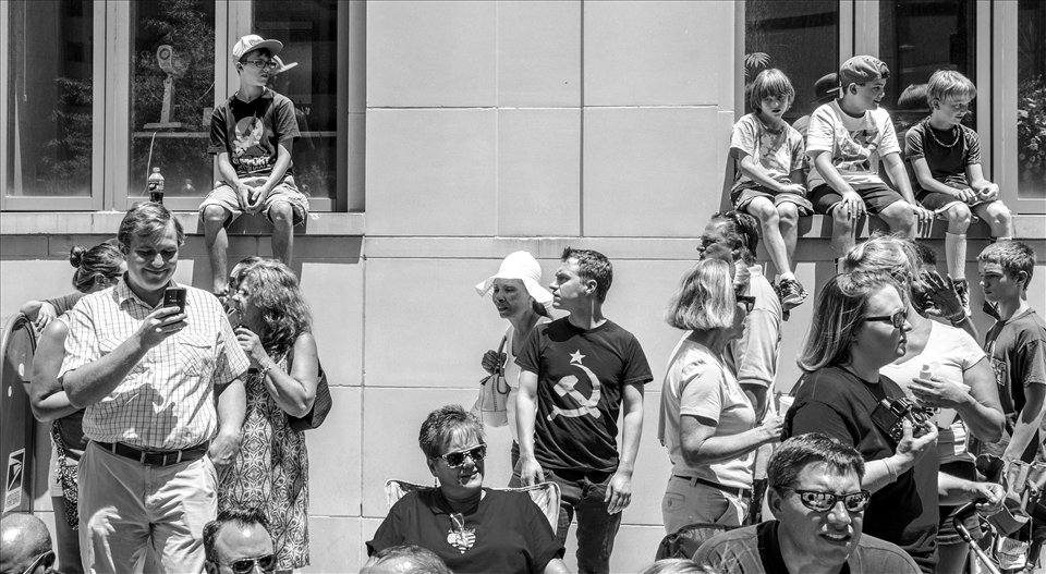 A young man wears a communist symbol during the 4th of July parade in Lexington.