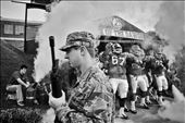 An ROTC stands guard a university football team comes on to play.: by deepanjan, Views[488]