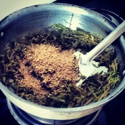 Keep turning the grated bottle gourd skin over until crisp, light and brown