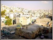 The signs of the partition are all too visible. Barbed wires literally run by front yards of Arab houses, in many cases making the inhabitants to desert their homes and take shelter in refugee camps. Israeli soldiers, far outnumbering the settlers, are everywhere, restricting Arab movement in the Israeli area. It seemed every rooftop had a soldier's post.: by deepthought, Views[327]