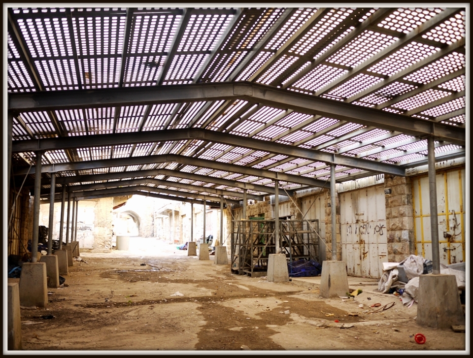 Like most towns, it has a thriving market on the main street. However, Israeli settlers came with the encouragement of the government, and made a part of the town their own, displacing Arab people from their homes and businesses. A few blocks along the main street, and the markets are long closed as a result of partitioning the city between Arab and Israeli areas.