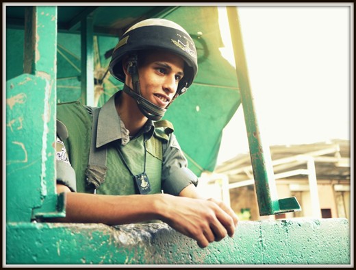 A young Israeli soldier, asking if the pictures will be on facebook.  Life never stops, even in the most dangerous of places.