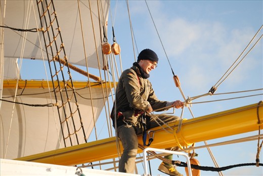 The morning after. A crew member straddles the boom making repairs before we made port in Dublin. If was shortly after sunrise and the mood on board was jubilant as we had claimed second place in the race and survived the big storm.