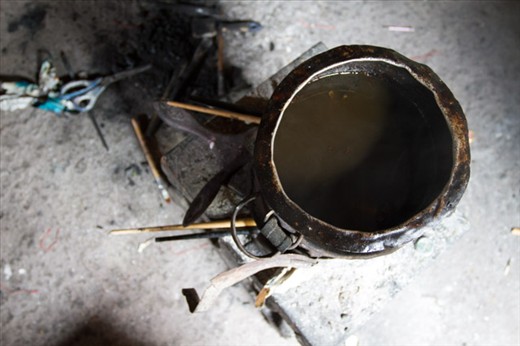 The majority of the work is done with a paintbrush and hot melted candle wax.