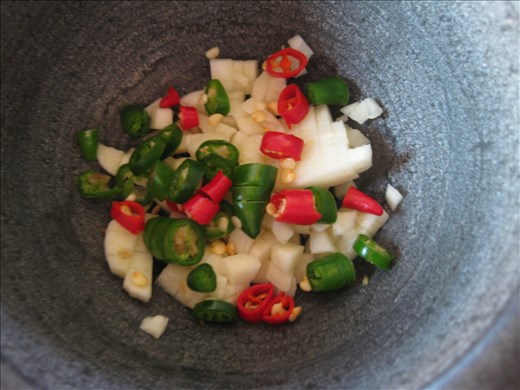 Chopped garlic & chile peppers in the mortar