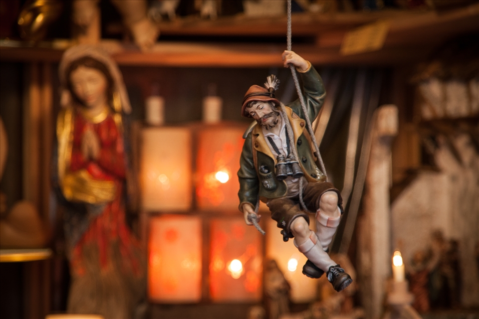 As I ventured further into the town of St. Gilgen, I stumbled upon a small Advent Market. It was mid-day and the streets were quite empty, but the stalls were all open and I had a little browse to see what I could find to put under the Christmas tree back home. This decorative toy, hanging from the ceiling of one of the stands made me feel like I was him - up in the mountains hunting for a bargain. This stand was particularly well decorated, and sold some of the most intricate nativity scenes and religious dolls I've ever seen.