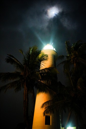 The Galle lighthouse trying to Compete with the moon to help ships navigate.