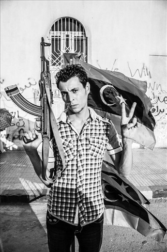 One of the Libyan rebels serving and protecting the local people of Benghazi.