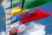 Prayer flags fluttering in the wind at Kunzum La, the gateway to the valley. The sutras(prayers) are released to the wind to purify the air and appease the gods. The colours represent the elements: Space(Blue), Wind(White), Fire(Red),  Water(Green) and Earth(Yellow), the balance of which is said to promote peace, strength, wisdom and compassion.: by descorpio86, Views[589]