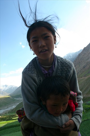 Local children may be hardy and ruddy but retain their immense warmth and curiosity. While the boy seemed a bit circumspect of this stranger, his sister enveloped him in a protective hug and welcomed me with a cheerful, 'Julaay!'.