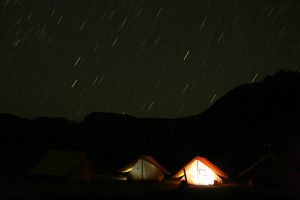 Enlightenment found under the stars, or just friends playing a game of cards? The star-lit sky never ceases to amaze me, and as the universe paraded itself in all its glory I wondered if the tent was lit up by the warmth of camaraderie or something else.