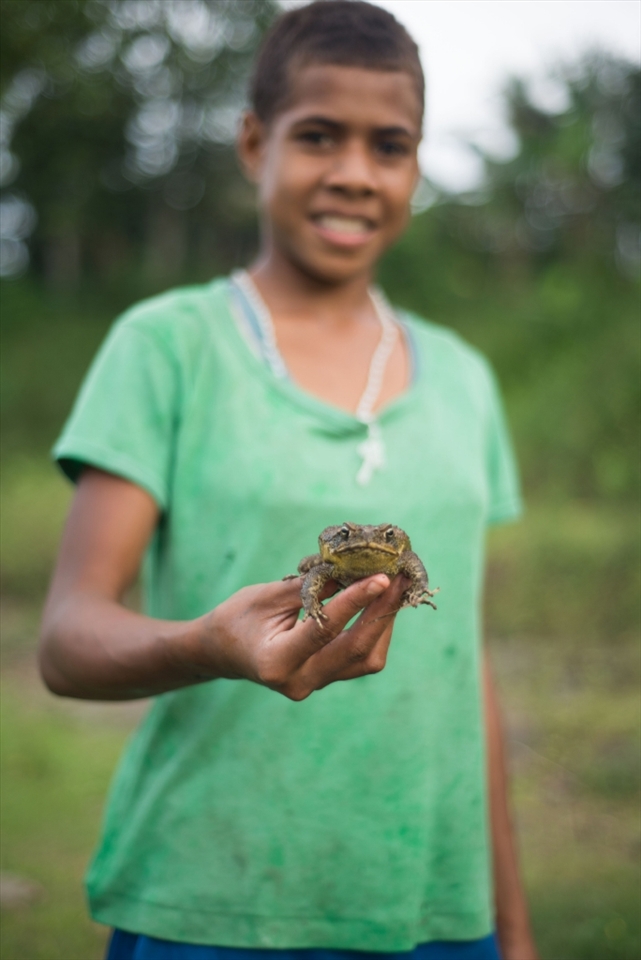 Mary holds out the frog she caught whilst spending the afternoon by the river with friends. She did her best to torment amphibian phobia suffering friends by putting the frog in their clothes and throwing it at them, much to her delight. Navala is home to around 800 people and the community is close knit. Children sometimes spend time after school down by the river to pass the time, the older ones looking out for the younger ones. 