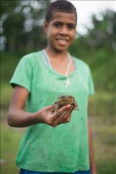 Mary holds out the frog she caught whilst spending the afternoon by the river with friends. She did her best to torment amphibian phobia suffering friends by putting the frog in their clothes and throwing it at them, much to her delight. Navala is home to around 800 people and the community is close knit. Children sometimes spend time after school down by the river to pass the time, the older ones looking out for the younger ones. : by devonhanna, Views[559]