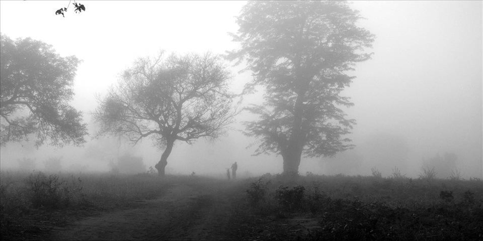 A man beginning his long journey to his much needed job in the early hours of th