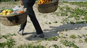 A fruit seller walks the beach trying to sell some fresh fruit in the popular resort of Sanya, an island off the South Coast of China (popular with the new rich Chinese and Russian tourists): by dh4mill, Views[323]