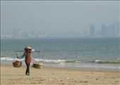 A fruit seller on the beach in Sanya, an island off the South Coast of China with the new skyscrapers ever present in the background.: by dh4mill, Views[338]