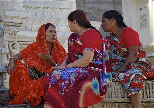 Women wait for their husbands near the segregated temple entrance