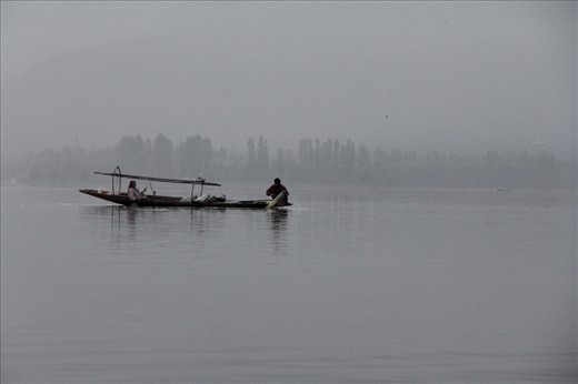 Waking up before sunrise, a husband and wife set their nets to catch fish.