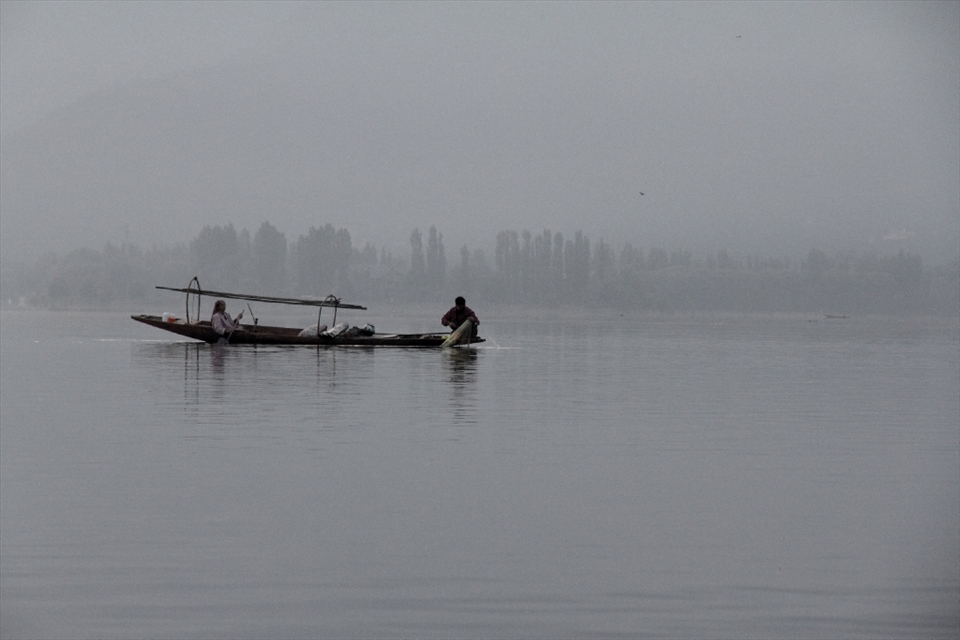 Waking up before sunrise, a husband and wife set their nets to catch fish.