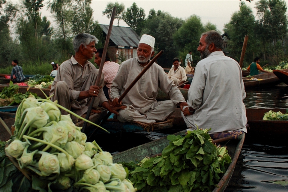 At the floating market in Srinagar, men not only haggle the prices of vegetables, but catch up on the latest gossip.