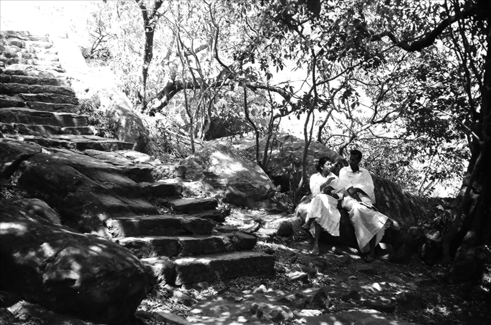 Mihintale, One of the famous sites in Sri Lanka where you can walk through ruins and climb up the steps to the top where the stupa is. However, if you take a walk out of the main path and go into the forest you will find people come to find their peace with other ones. In this photo is friends meditate and discuss things on sunday morning.
