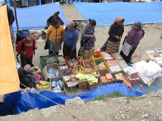 Although Kathmandu is famous for its marketplaces this weekly market in Namche Bazzar is no less lively. It provides necessary supplies to lodge owners throughout the region. Some of them travel for days each way to purchase them with the merchants coming from possibly even greater distances. 