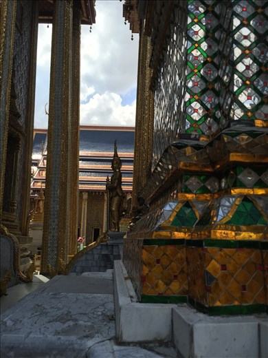 View of Buddha through columns at Wat Po