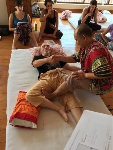 Aaron as the demonstration body during class for our instructor, Jeep. 