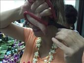 Dina hacking off a chunk of hair, with very dull scissors, to add to the Khoy Lom. : by dinagosse, Views[344]