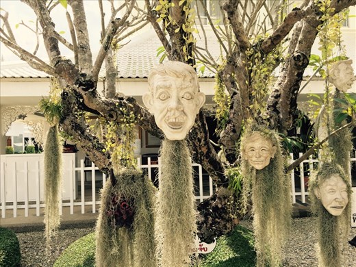 Ceramic heads festooned with 