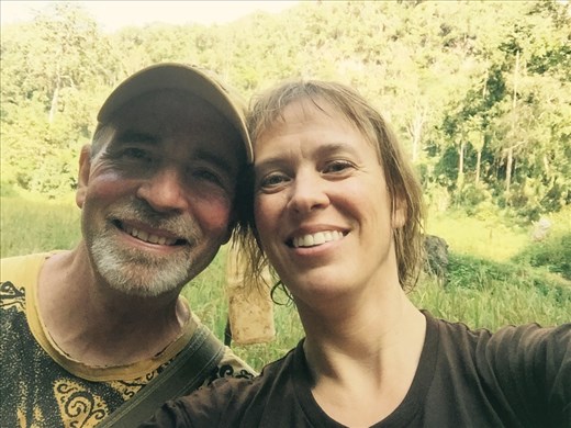 We survived Waterfall Cave!!  Aaron and Dina take a break in the jungle. 