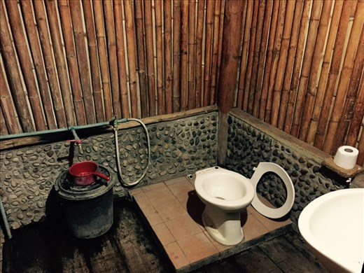 Our hut's bathroom!  Comes with detachable toilet seat!