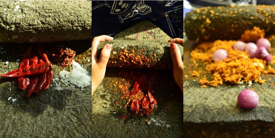 Grinding the ingredients together on a traditional grinding stone