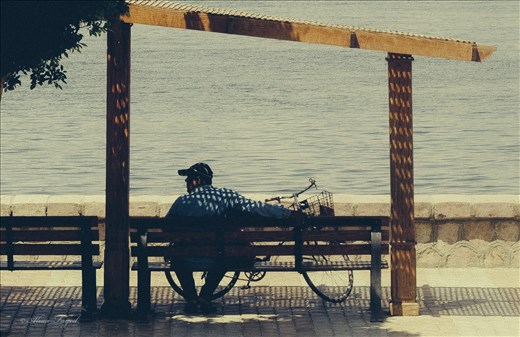 A man with his bike taking rest opposite to him is The Nile . 