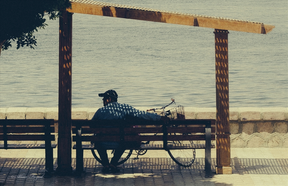 A man with his bike taking rest opposite to him is The Nile . 