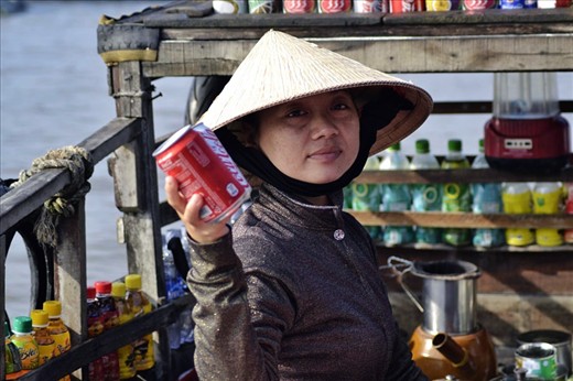 Woman selling Coke to Westerners