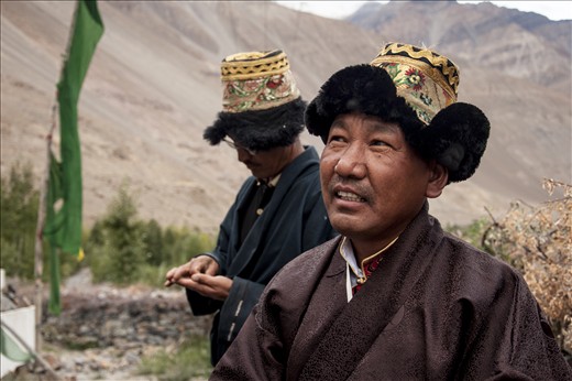 The community is nearing the crossroads of preserving traditions or embracing the modern, with younger generations having migrated for work to urban cities have started finding traditional practices unnecessary. In an attempt to preserve the heritage, interestingly, a fine of Rs. 200 (roughly $ 4) is taken by the village council if one fails to stick to the “dress” code. Dressed in chollu, the traditional attire, resident Tashi Tenzing observes the final leg of the proceedings as light blends into twilight. 