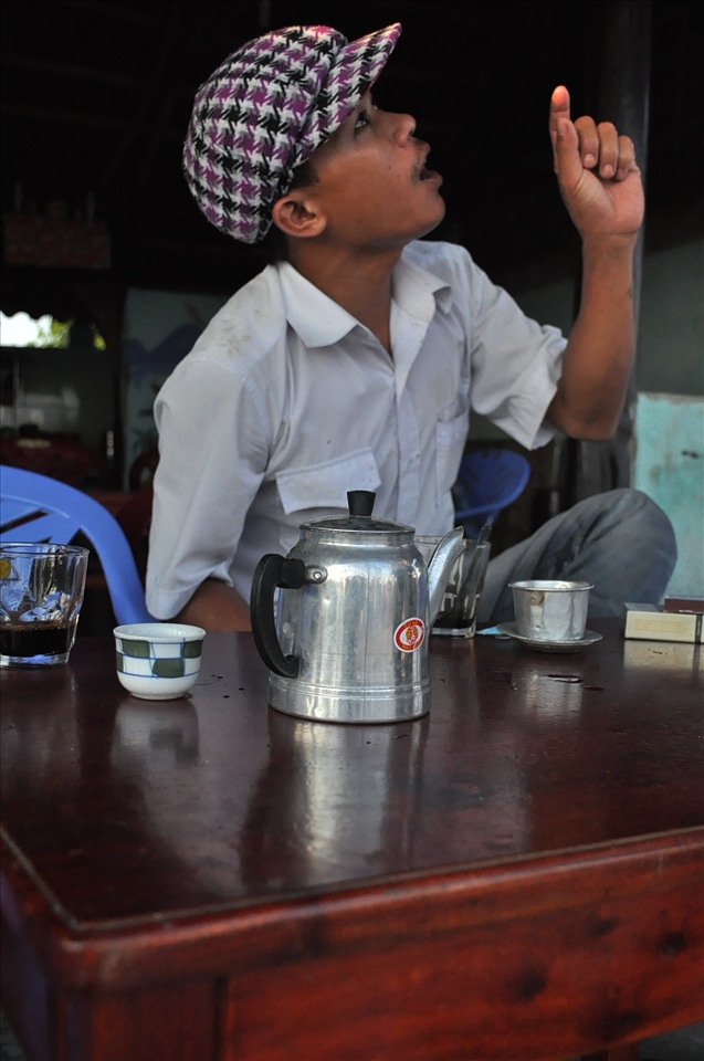 A man sitting in a cafe asks us for foreign cigarettes.